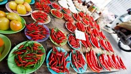 A variety of peppers on a table.