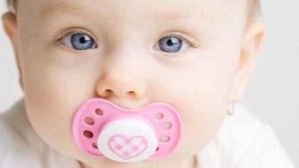 A baby with a pacifier.