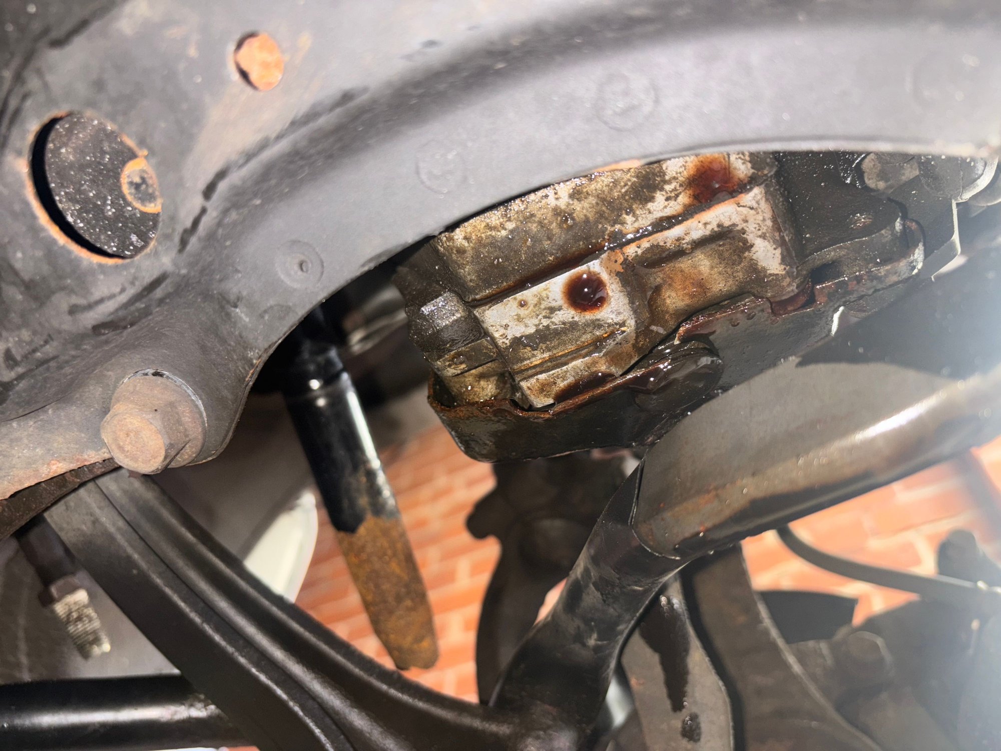 got into an accident recently and started leaking tranny fluid this is the only spot it�s leaking from but what is that black part? looks like it bolts in and i�m hoping that�s where and all it is causing the leak. can someone please help if they can what should my next steps be? base model 03 TL