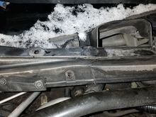 this is simply meant to show the join/seam of the cowl directly over the wiper motor - so yes, two pieces here, and the passenger side comes off first.  The driver's side is a bear, so be patient.