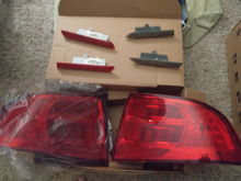 Oem tail lights and side markers.
