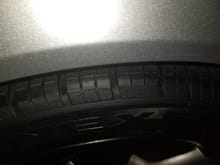 Rubbing is only on the edge of the tire and right at the top of the fender lip.