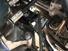 remove the clutch line with a 10 socket and move the line out of the way. You don't want it breaking when you move the tranny out of the way.