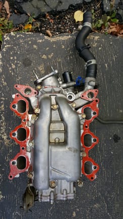 Intake manifold with thin layer of gasket maker.