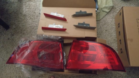 Oem tail lights and side markers.