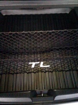 Painted TL logo on the trunk tray.