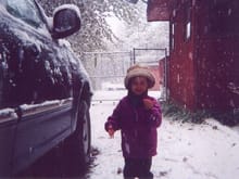 My daughter Abigal showing me a snow flake she caught. This was taken 9-25-2004 and was our first snowfall for the winter, 6 inches fell that day.