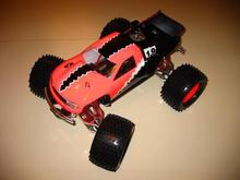 This is my Nitro Powered Remote Control T-Maxx, complete with full aluminum chassis, and custom painted Stadium Truck body(design based on '01 Honda C                                                  