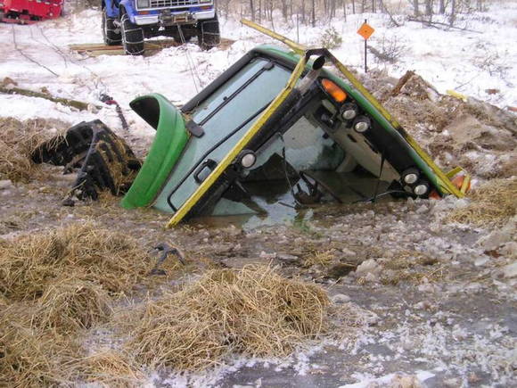 The ground was snow covered, but underneath this trail groomer found an unfrozen swamp in early December 09. During three days of futile attempts to pull it out, this large machine kept sinking deeper, untill it tipped over. It was finally retrieved with the help of special equipment. ATV RIDERS, BEWARE OF THE BOTTOMLESS SWAMPS OF NORTHERN WISCONSIN.