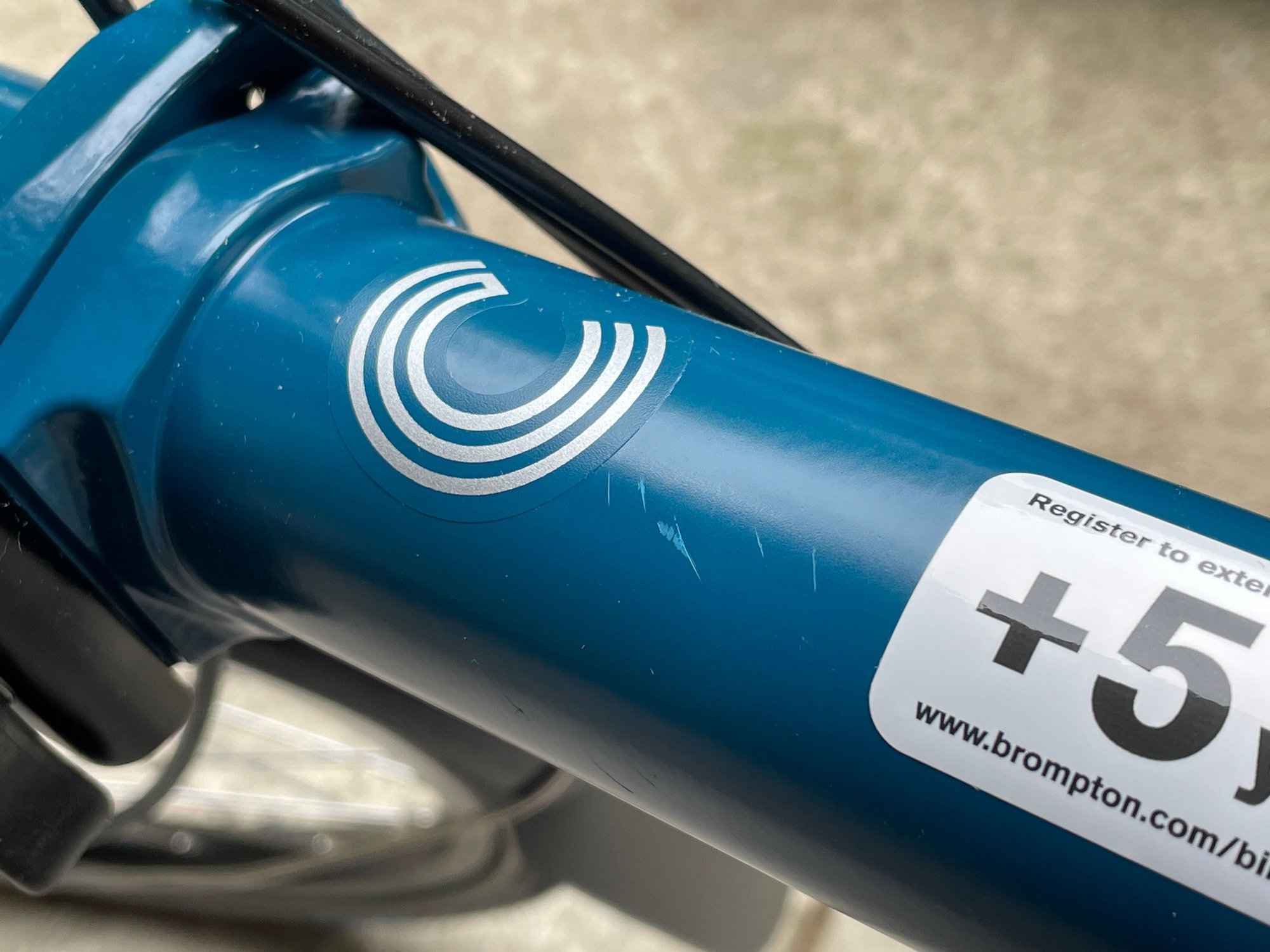 Superficial scratches in the top tube below the C.