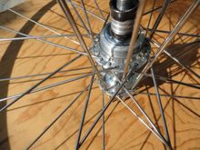 By placing the spokes through the star pattern closest to the hub flange they will drop through a bit easier.