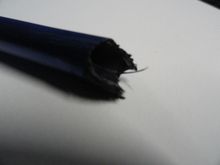 This is a close up of  the damaged CF showing the layers or plies of the CF as it was produced. 