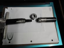 The other tool that will remove a cup from either side.   Make out of 1/2" drive sockets and race car lug  and lug nuts.