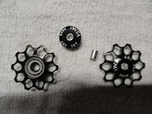 New  pulley wheels honeycomb design. Black paint with white printed logos.