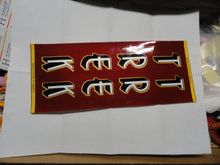 These were adhesive backed pretty heavy vinyl with the Trek logo printed on them.