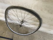 Pity about the wheel - that's a Mavic MA.  I bet I can swap this and the surviving rear out for a set of Sun CR-18s and re-use the DT butted stainless spokes.
