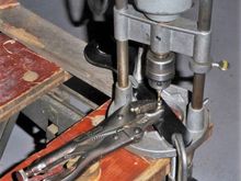 Post-production mock-up for photograph, not in real time.  The workpiece has already been drilled and tapped.  In use, my protected left hand would be holding the ViceGrips and my weight would be pressing down on the drill.