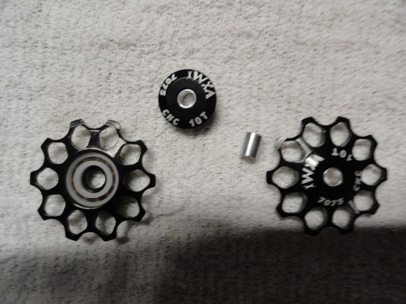 New  pulley wheels honeycomb design. Black paint with white printed logos.
