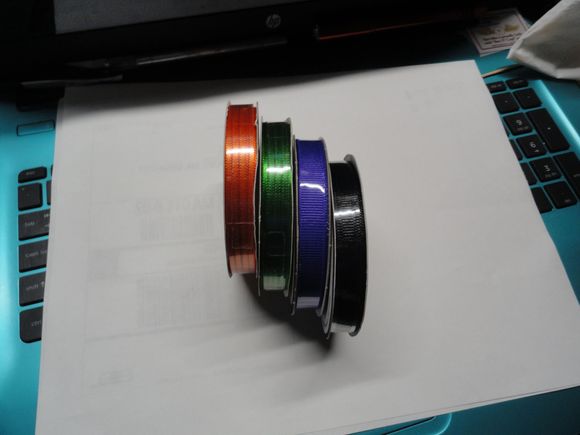 Ribbons in Jdawgs four primary colors to make my own handlebar streamers.  Now to just get some bar plugs and a drill to make the streamers fit.  