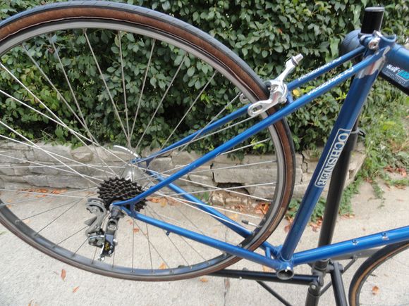 So the rear wheel has stayed intact for a week and should be rideable.  I got the special bolt and fixing part to use the Duopar rear derailleur with the Helicomatic free wheel.  The brake is a through bolt type that will require making a special shim to make it work.  