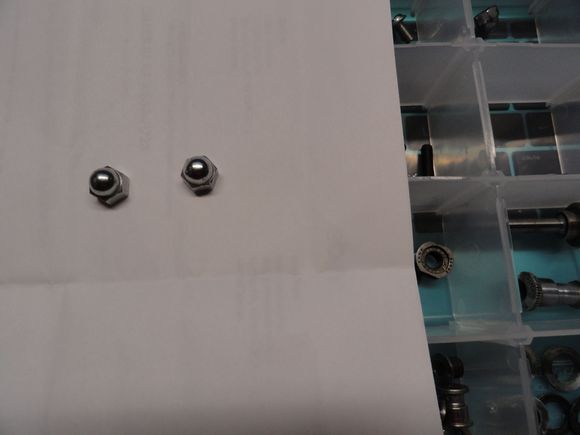 One pair of chrome acorn lock nuts for Campy brakes.