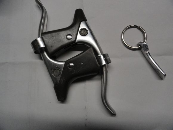 Levers ready for cover install.   Left shifter lever after lots of work to save enough for the keychain fob.    