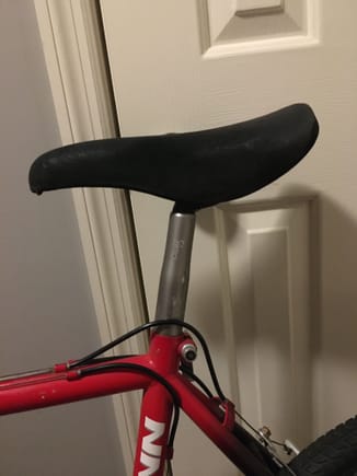 Odd tapered and stuck seat post. Looks like a concor seat...