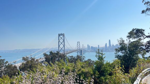 .A panoramic view, left to right: Bay Bridge, San Francisco. Viewpoint with an odd spire, Alcatraz Island, Treasure Island flats.
