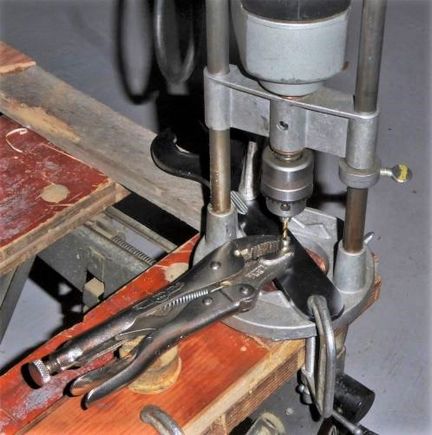 Post-production mock-up for photograph, not in real time.  The workpiece has already been drilled and tapped.  In use, my protected left hand would be holding the ViceGrips and my weight would be pressing down on the drill.