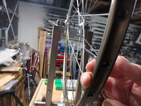 Working from the outside of the rim so I can watch the nipple turn ensuring I am turning the right way.