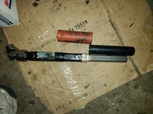 Lower intermediate shaft with the orange rubber sleeve and the upper black plastic sleeve.