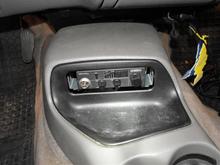 I used the same bracket that held in the cassette player. Works like a champ and now I can slide out the CB radio on the fly.