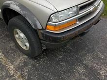 Close up of the missing flare and rusted bumper.