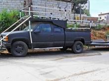Z71 cam5 in satin black with trailer behind