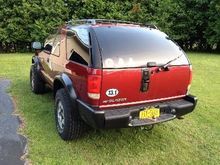 Rear before work.  I have already taken the spare carrier off, but haven't gotten to the latch plate yet.