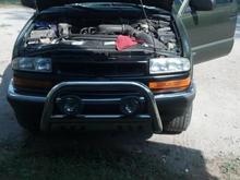 Painted grill with original headlights.