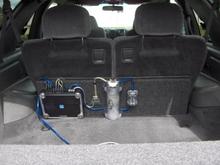 Picture 266 Will be adding an alpine pdx 1.1000 1000 watt rms amp where the empty spot is, Will balance out. might have tospace out distribution blocks to add 1 more capasitor or replace the 1.2 farad,with a 5 farad. will post a pic of the replacement.