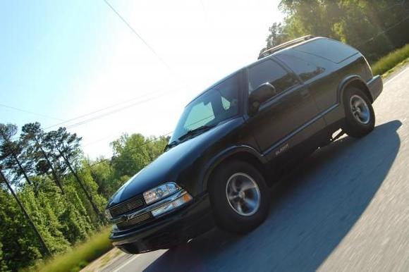 The front of my truck on the road.