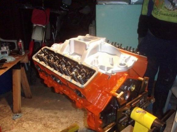 Engine /w edelbrock rpm manifold, and Pro Toplin S-RT heads mocked up on stand after painting.