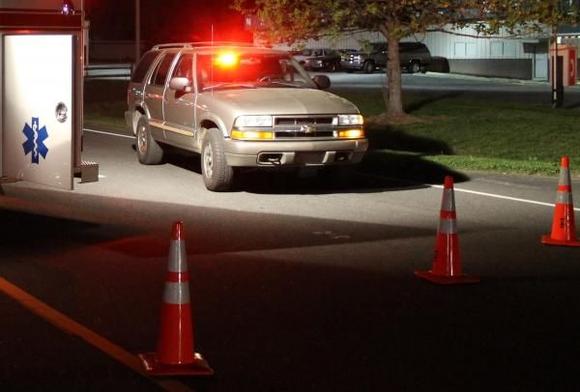 The Blazer blocking the road for a traffic accident.