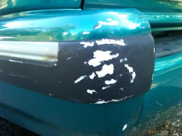 I had gouges in the rear bumper trim (because my sister owned the vehicle before I did and seemed to back into alot of things) and I used Spot Putty to fill in the low areas. I then sanded it with 1200 Grit (wet or dry) sand paper. Taped the area off and primered it, sanded it until it was uniformally smooth and painted it with Spray Max 1K Black Trim Paint (11.3 oz) at Napa Auto parts for $14.00.
