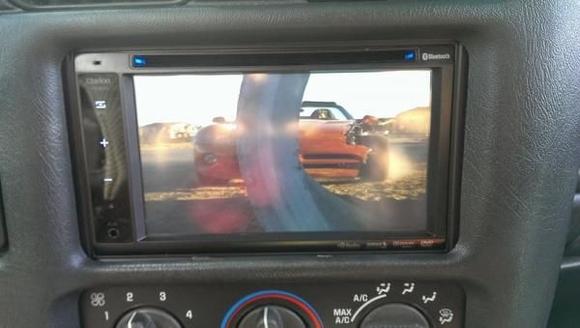 Double din Clarion VX401 with 03-up dash bezel and hand made steel mounting brackets and hand made rubber radio support bracket. Sorry no pics of the custom mounting hardware.