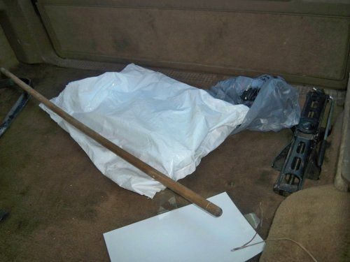 Back floor with stuff in it. The stick is to hold up the back window. I'll be getting new (cannot remeber the name) for the back window to hold up. They are 20.00 a peice with the heater wire in them. However, the back window somebody took off the wire blocks. WTF. Also the back window wiper doesn't work.