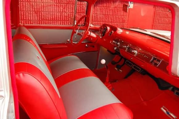 Lush red interior.  Lots of performance mods, but she's still a 57 inside and out.