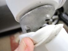 Alloy arm where it fastens to mirror head. The head is bolted rigidly to the arm from inside the mirror shell.