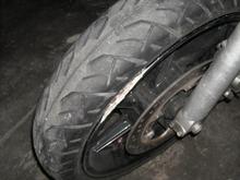 concrete stuck between my rim and tire from the wreck