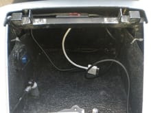 Inside of rear box has iPod conection to controler on handle bars, head phone jack to side of bike, AC charger and light switch and light. Made to have a lot more storage room than original.