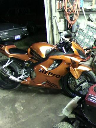 2002 CBR 600 F4i--Mandarin Orange Candy Paint--CHROME/CARBON FIBER WINDSHIELD--BILLET BAR ENDS--CHROME FRAME SAVERS--BILLET GAS COVER--CHROME SR3 Yoshimura Exhaust System--ALU Exhaust COVER--BILLET FOOT PEGS--EURO TAILLIGHT--REPSOL GRAPHICS KIT--CARBON FIBER TANK PROTECTOR...NO SCRATCHES ANYWHERE...THATS ABOUT IT...