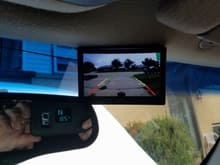 Mounted monitor up by rear view mirror. Current display rear camera.
