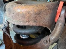 Had a rattle and this is the passenger side. 

The old shock on this side was missing bushings 